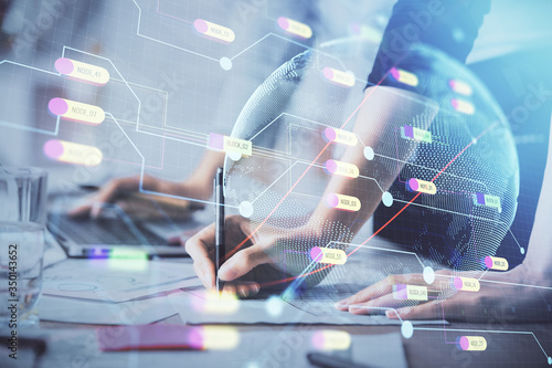 Double exposure of woman hands working on computer and world map hologram drawing. International technology business concept.