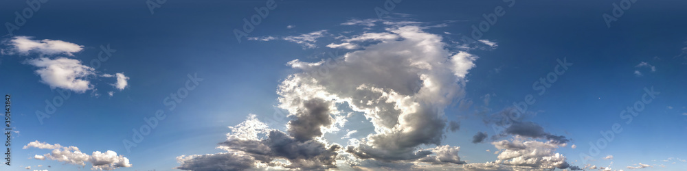 blue sky with beautiful dark clouds before storm. Seamless hdri panorama 360 degrees angle view with zenith for use in 3d graphics or game development as sky dome or edit drone shot