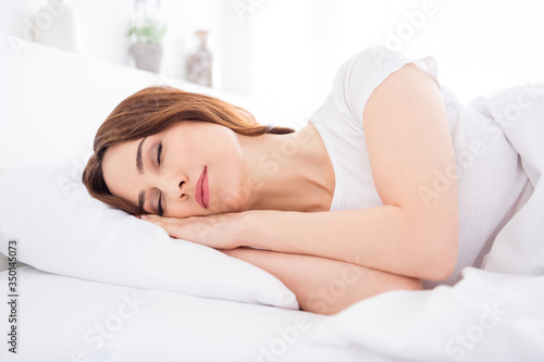 Close-up portrait of her she nice attractive lovely pretty calm red haired girl lying in bed sleeping sweet dreams in modern white light interior style room house apartment