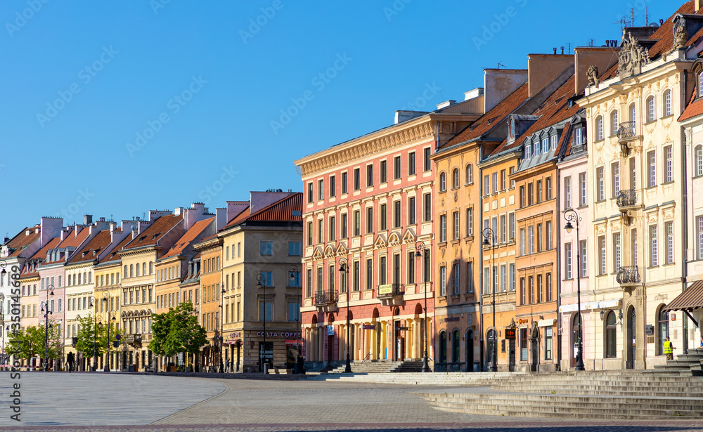 Panoramic view of Krakowskie Przedmiescie street with historic tenement houses in Starowka Old Town quarter of Warsaw, Poland