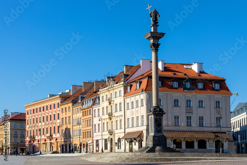 Panoramic view of Krakowskie Przedmiescie street with Sigismund III Waza Column monument and historic tenement houses in Starowka Old Town quarter of Warsaw, Poland