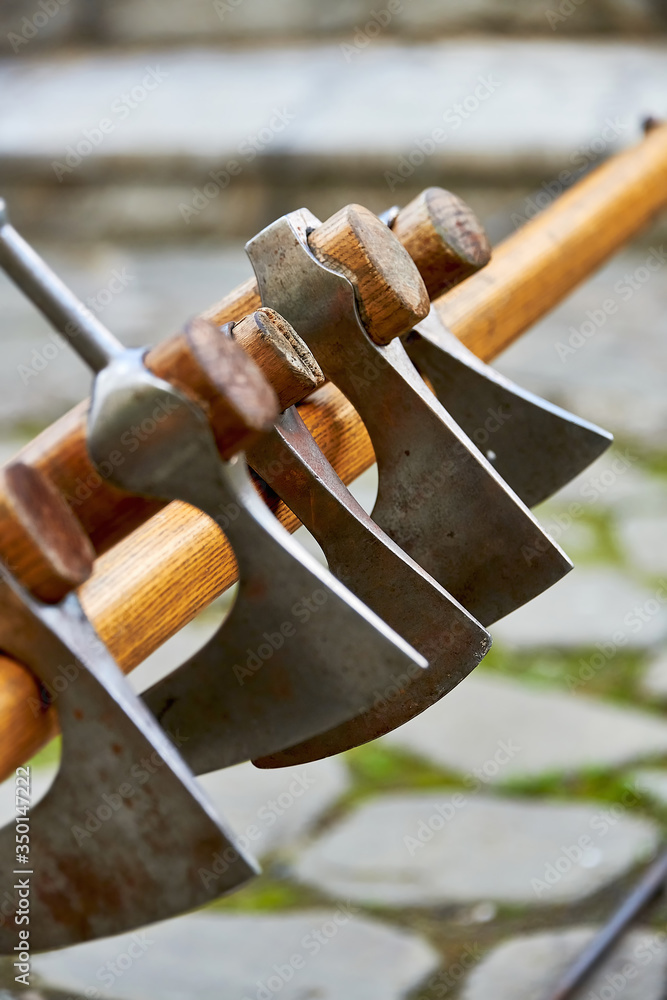 Battle axes of ancient warriors on a stand. The battle axe is an