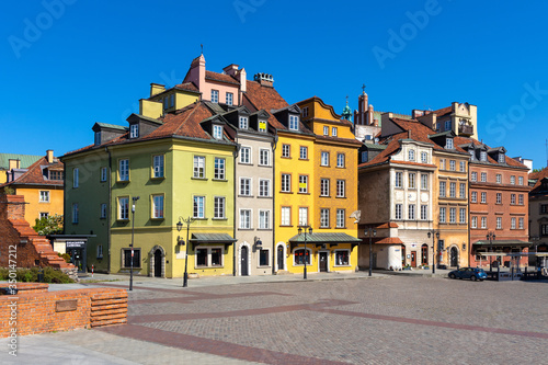 Panoramic view of historic colorful tenement houses at Royal Castle Square - Plac Zamkowy - in Starowka Old Town quarter of Warsaw, Poland