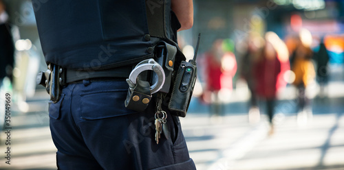 policeman with blurred people in background