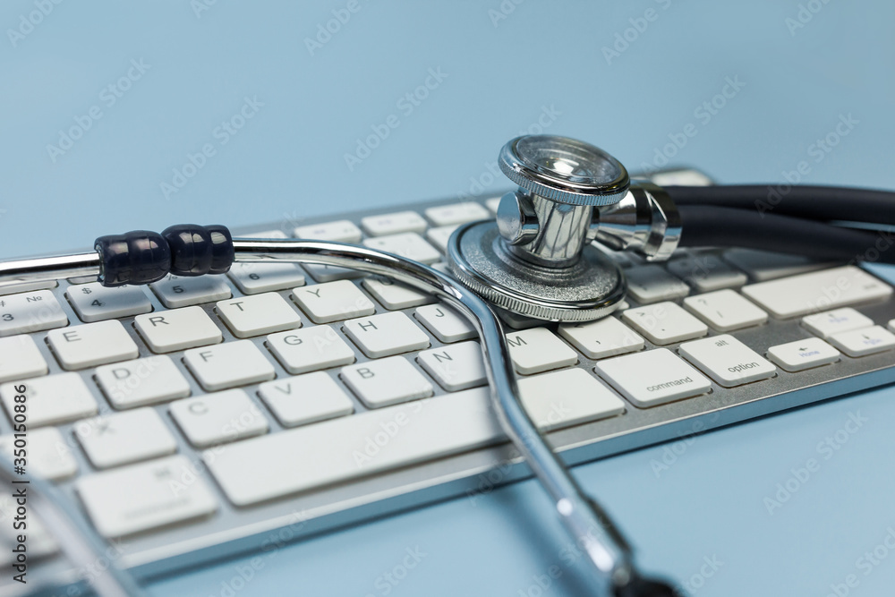 A stethoscope and a computer keyboard. Computer technology and medicine A stethoscope and a computer keyboard. Computer technology and medicine