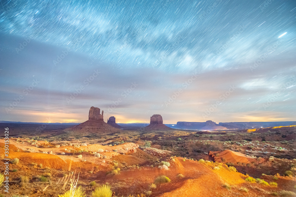 Monument Valley at night, long exposure with moving clouds