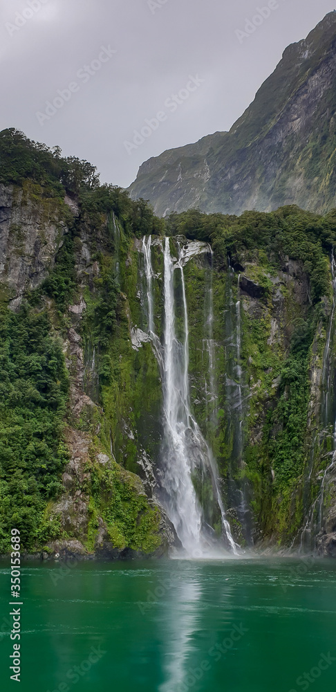 Obraz premium Beautiful Milford Sound in New Zealand and it's waterfall. 