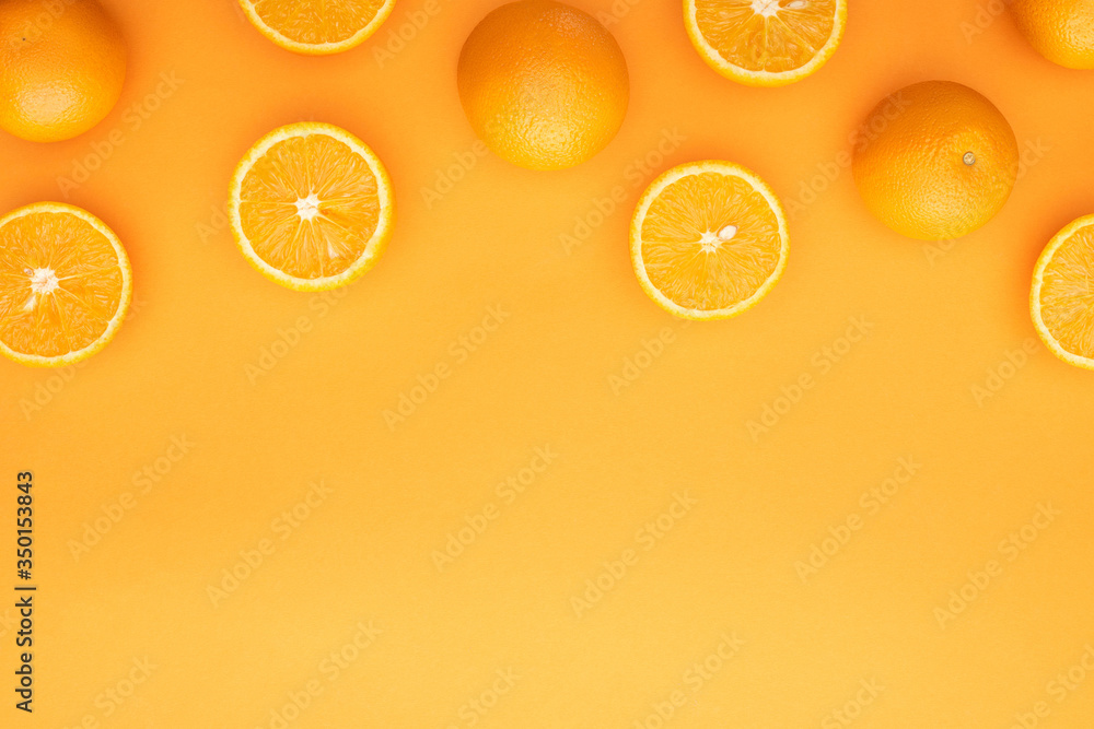 top view of ripe juicy whole oranges and slices on colorful background top view of ripe juicy whole oranges and slices on colorful background