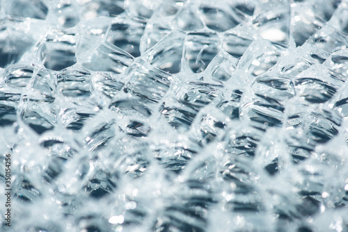 close up view of abstract transparent ice textured background
