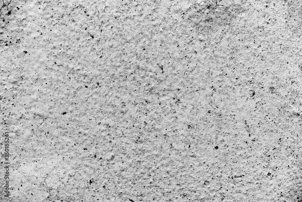 Texture of a concrete wall with cracks and scratches which can be used as a background Texture of a concrete wall with cracks and scratches which can be used as a background