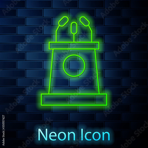 Glowing neon line Stage stand or debate podium rostrum icon isolated on brick wall background. Conference speech tribune. Vector Illustration