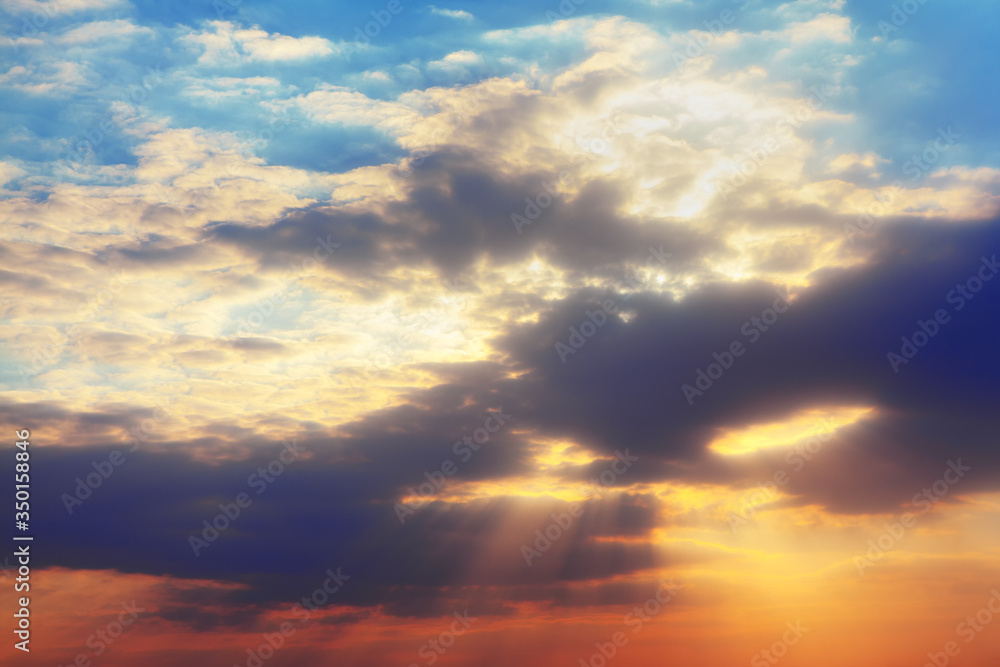 sun rays shining between twilight clouds sun rays shining between twilight clouds