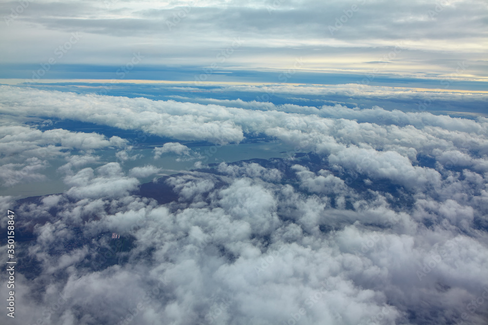 flight over the clouds and lake