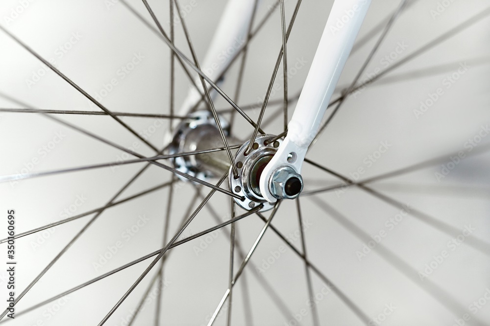 Bicycle wheel closeup front axle hub and fork