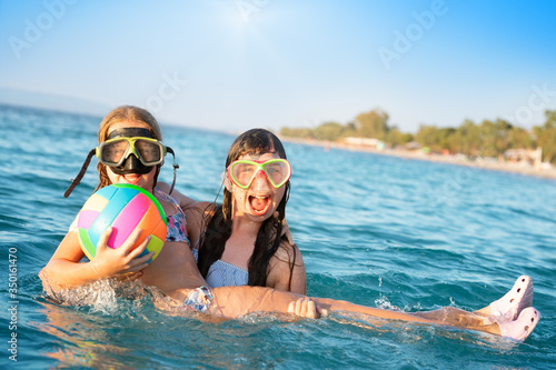 Girls play in seawater