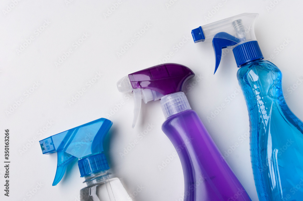 Plastic Spray Bottles on White Background, detergent for cleaning bathroom. Plastic Spray Bottles on White Background, detergent for cleaning bathroom.