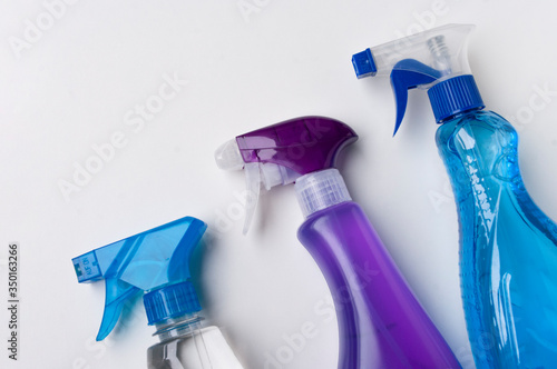 Bild auf Leinwand Plastic Spray Bottles on White Background, detergent for cleaning bathroom