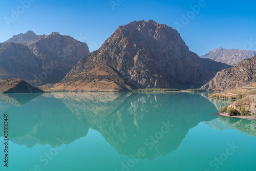 Fototapeta Naklejka Na Ścianę i Meble -  The scenic view of Iskanderkul lake and Fann mountains in Tajikistan