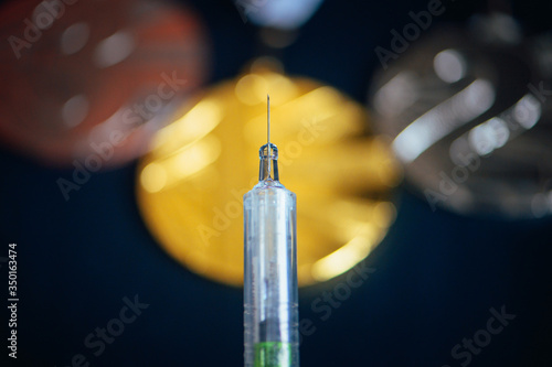 Foto Syringe and medal set in background
