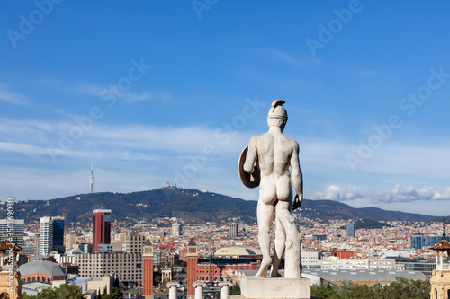 View of the Spain Square (Placa d`Espanya) with famous monuments and Tibidabo hill overlooking Barcelona, Catalonia, Spain photo