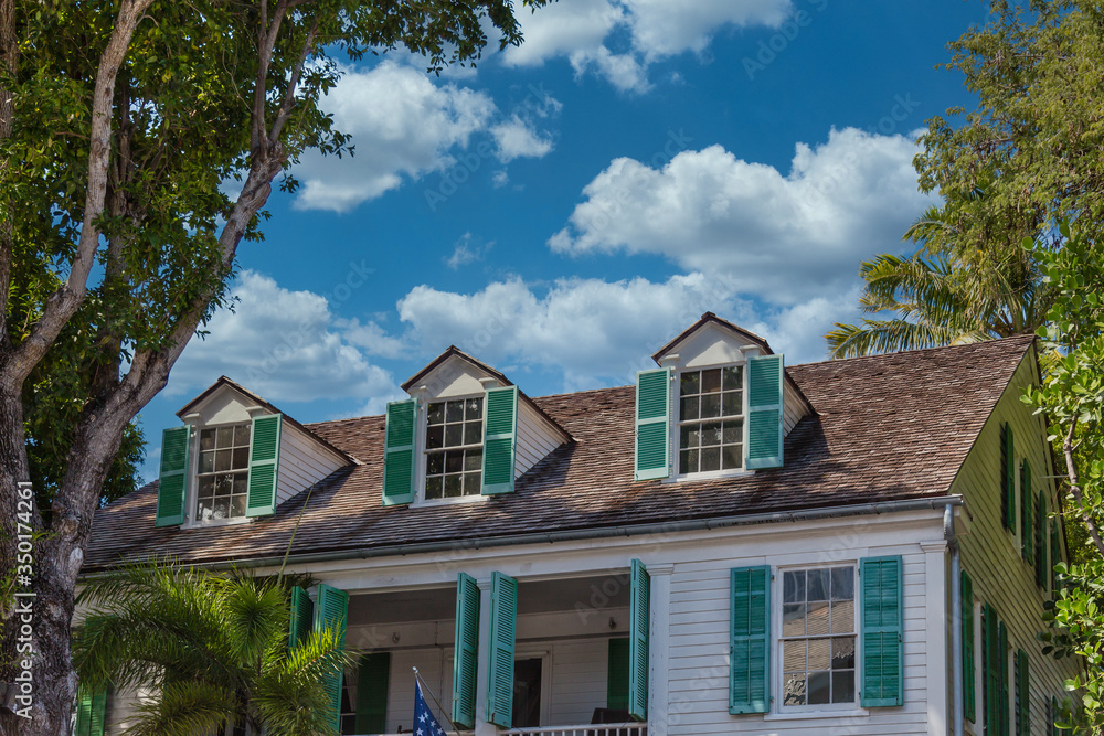 Green Shutters on Dormers of old house in Key West