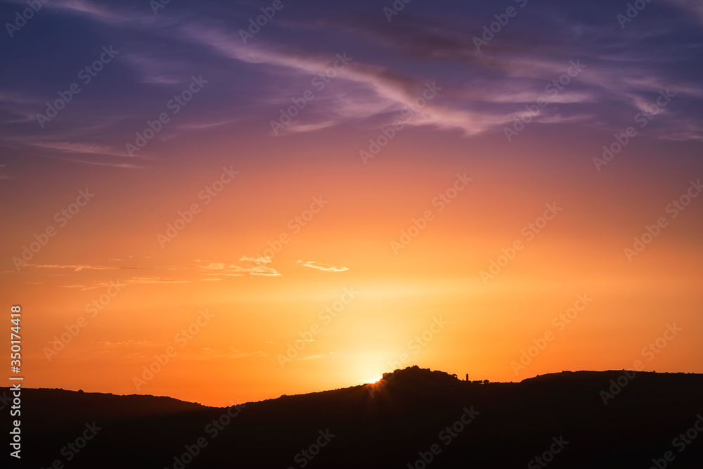 Fototapeta premium Sunset over village of Sant'Antonino in Corsica
