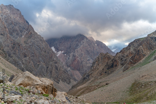 The beautiful view of blue sky and snow mountain summit near to Zmeya peak in Fann mountains in Tajikistan photo