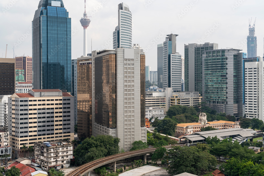 Obraz premium Panoramic view of Kuala Lumpur skyline at day time. City center of capital of Malaysia. Contemporary buildings exterior with glass.