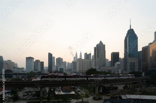 Panoramic view of Kuala Lumpur skyline at sunset. City center of capital of Malaysia. Contemporary buildings exterior with glass. © VideoFlow