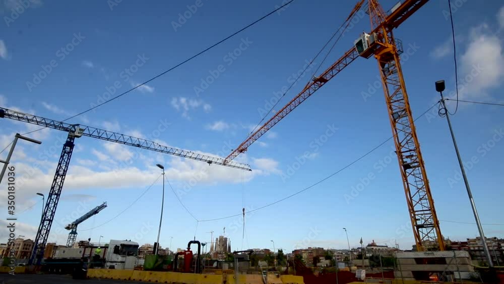 Construction site with crane working and cars during Coronavirus pandemic Construction site with crane working and cars during Coronavirus pandemic