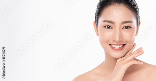 Beautiful Young Asian Woman touching her clean face with fresh Healthy Skin, isolated on white background, Beauty Cosmetics and Facial treatment Concept
