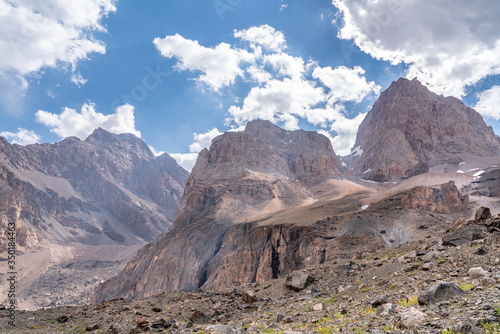 The beautiful view of blue sky and snow mountain summit near to Alaudin lake in Fann mountains in Tajikistan photo