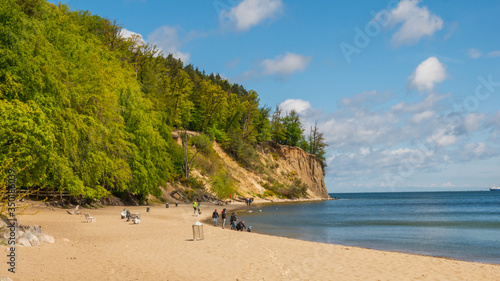 View of the cliff in Gdynia Orlowo with tourists in May.