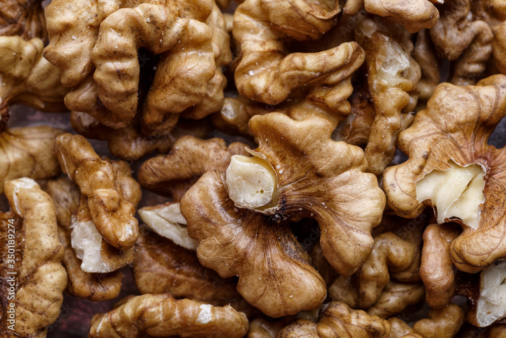 Peeled Raw Walnuts. Fresh organic Nuts. Raw nuts. Many delicious Walnuts as a food background. Peeled Raw Walnuts. Fresh organic Nuts. Raw nuts. Many delicious Walnuts as a food background.
