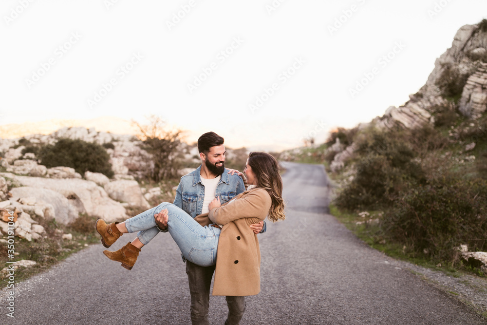 Front view man carrying his girlfriend