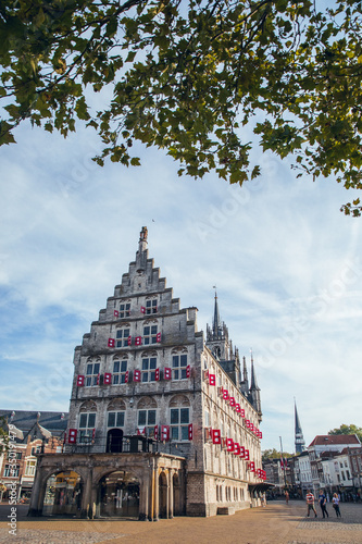 Gouda, Netherlands - June 29, 2019: Photo report of the Streets and center of the city of Gouda in Netherlands in Summer. Sunny day. City famous for its gouda cheese.