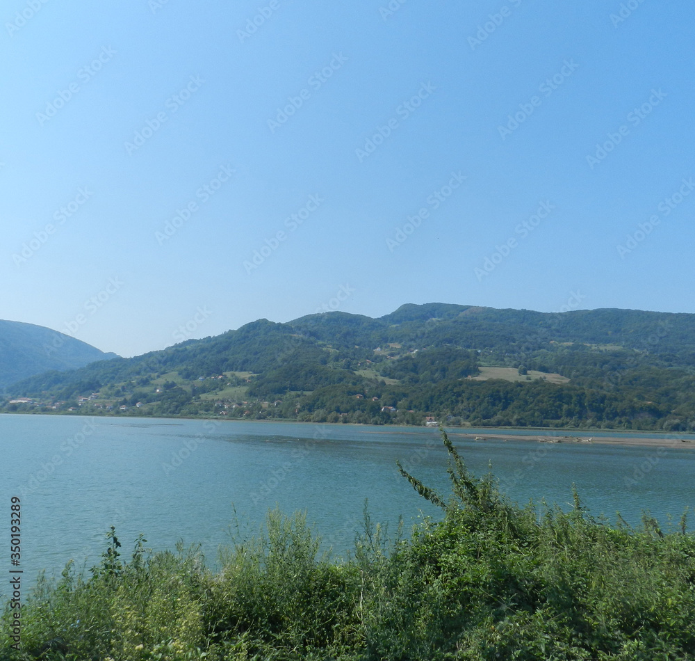Landscape from the lake with hills in the background