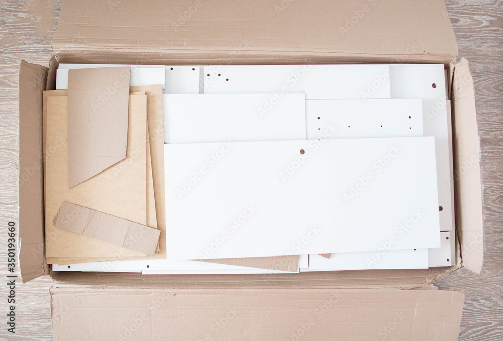 Box with furniture table. Assembly of new furniture, background, copy space Box with furniture table. Assembly of new furniture, background, copy space