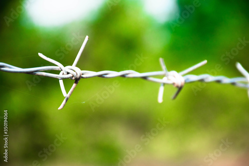 Barbed wire seamless.The old prison is surrounded by barbed metal wire