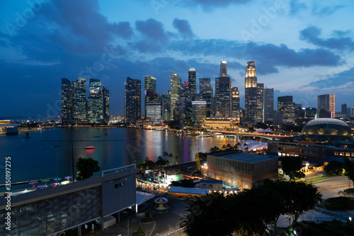 Photography Picturesque panoramic view of Singapore city at sunset