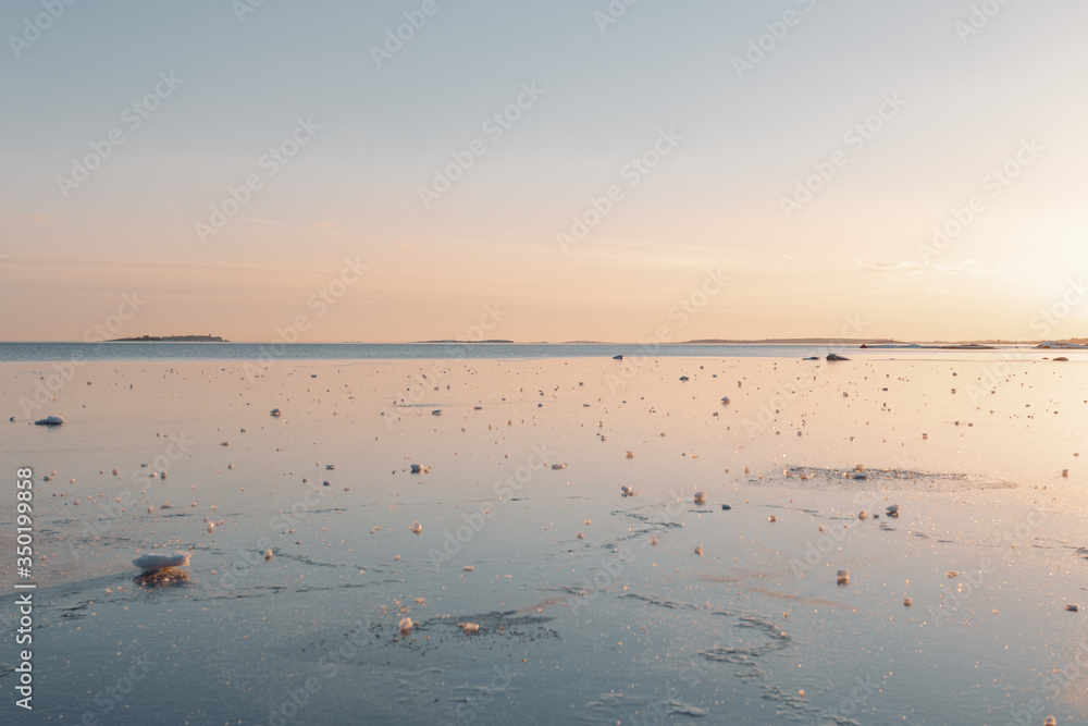 Sunset on frozen sea