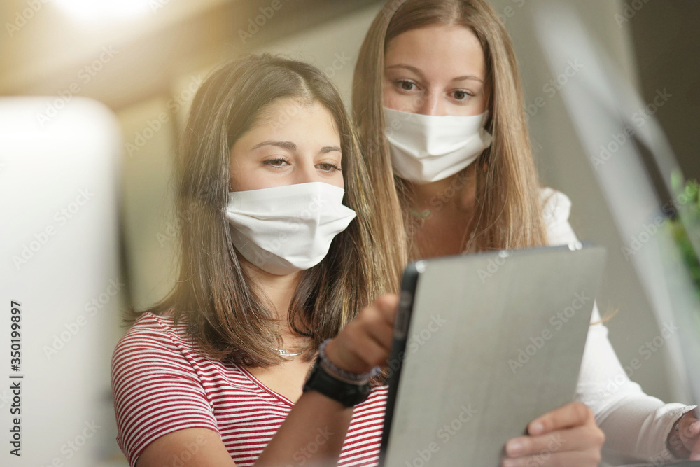 group of students working wearing masks group of students working wearing masks