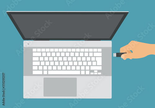 Flat design illustration of silver laptop with white keyboard and hand connecting flash drive to USB, vector