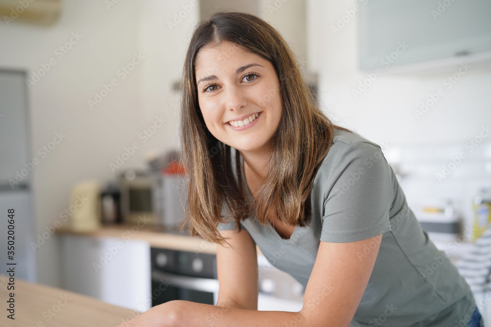 young woman smiling facing camera young woman smiling facing camera