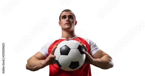 Photo of a soccer player who holds the ball isolated on white. Stadium and crowd made in 3D. © olgasidorenko