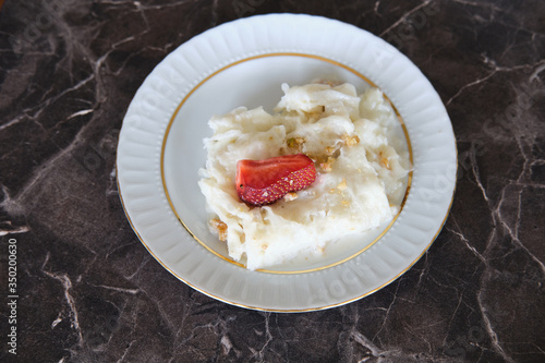 Traditional Turkish Ramadan Dessert Gullac . It is made with gullac (rice wafer or rice paper sheets) , milk, rose water, walnut, vanilla.