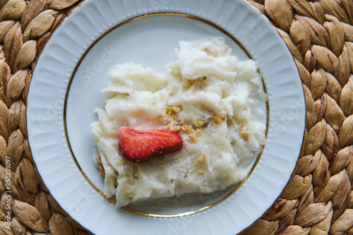 Traditional Turkish Ramadan Dessert Gullac . It is made with gullac (rice wafer or rice paper sheets) , milk, rose water, walnut, vanilla.