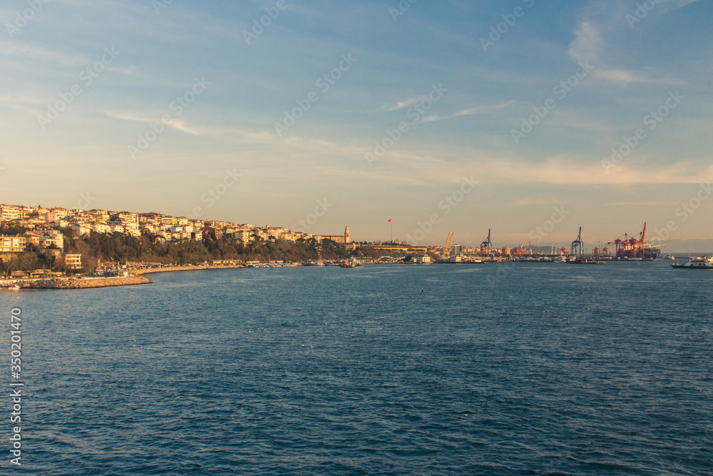 View of the Uskudar district  and port of Istanbul from the Bosphorus at sunset. Turkey