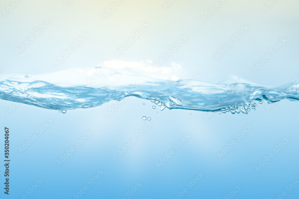 Water splash on blue background. Aqua flowing in waves and creating bubbles. Drops on the water surface feel fresh and clean. Water splash on blue background. Aqua flowing in waves and creating bubbles. Drops on the water surface feel fresh and clean.