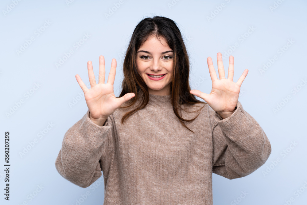 Young brunette woman wearing a sweater over isolated blue background counting ten with fingers Young brunette woman wearing a sweater over isolated blue background counting ten with fingers